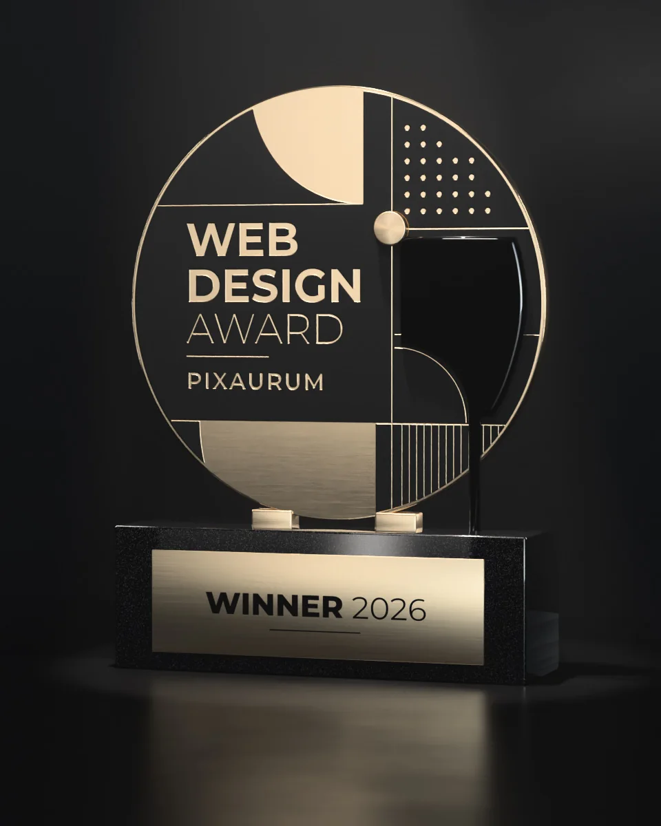 Trophäe der Pixaurum Webdesign Awards: Medaillon in Gold und Schwarz auf Granitsockel mit Schild „Winner 2026“