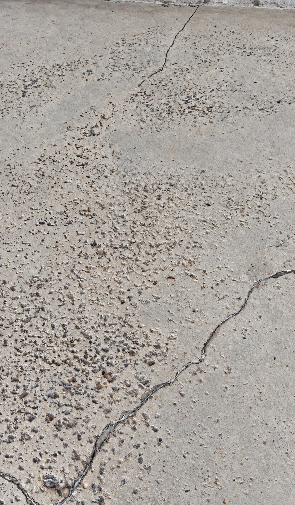 White road salt residue in garage tire paths on an Innisfil concrete floor