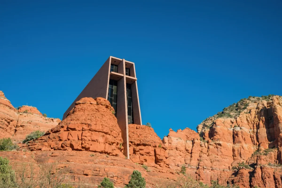 Chapel of the Holy Cross tower against a deep blue sky