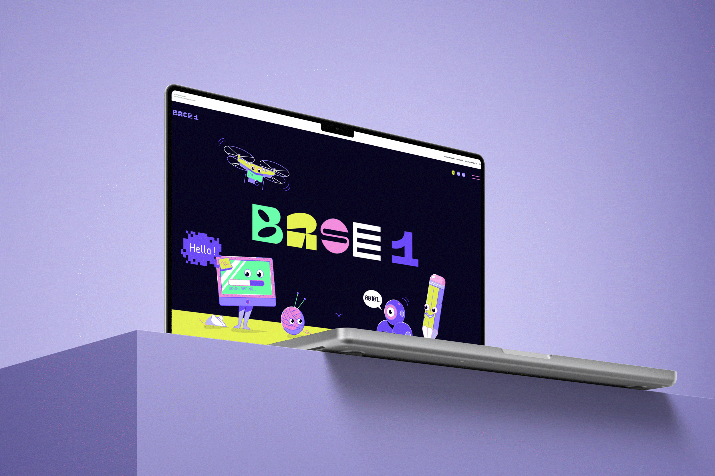 Base1 website on a laptop, with the animated logo changing shape between frames