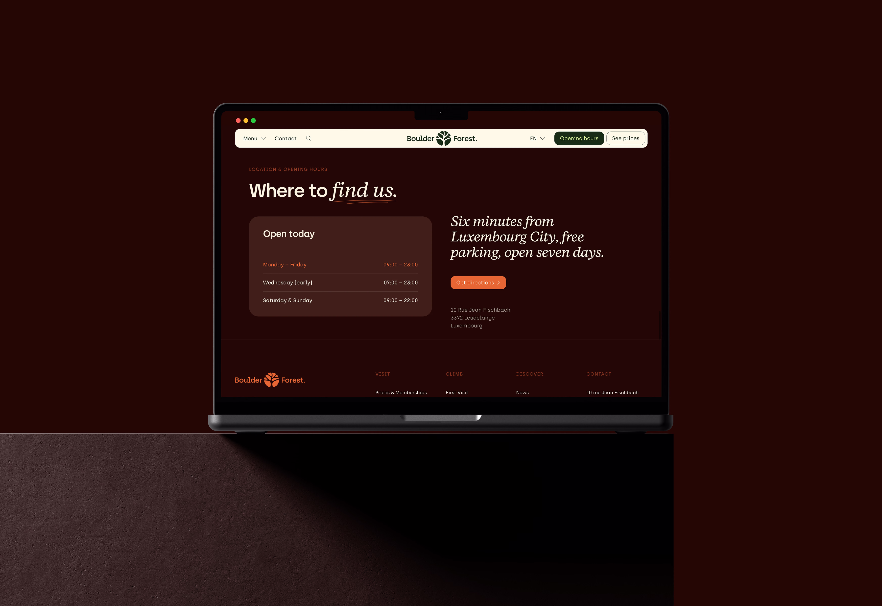 BoulderForest “Where to find us” page on a laptop, with opening hours in the dark Earth theme