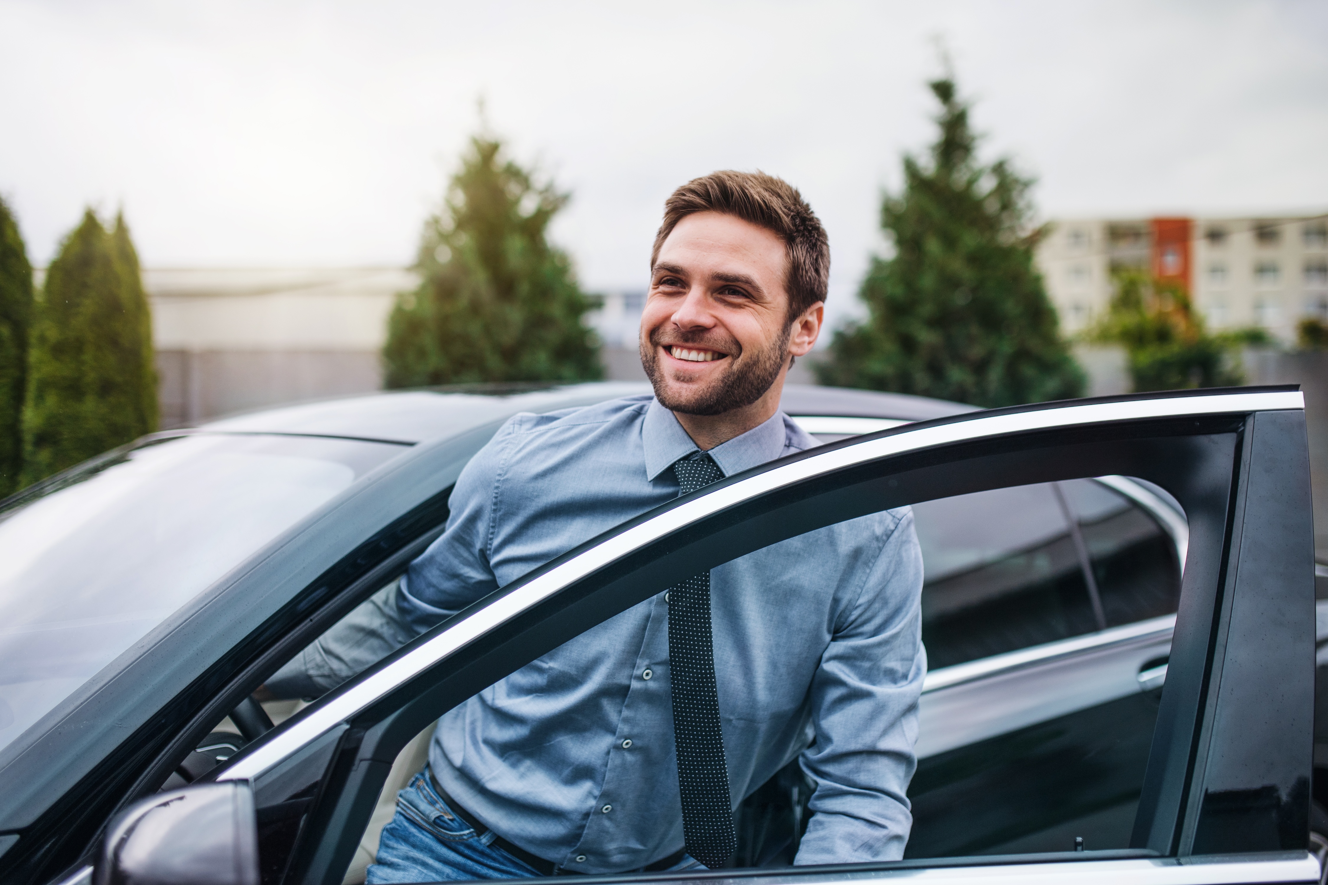 Man getting out of car stock image