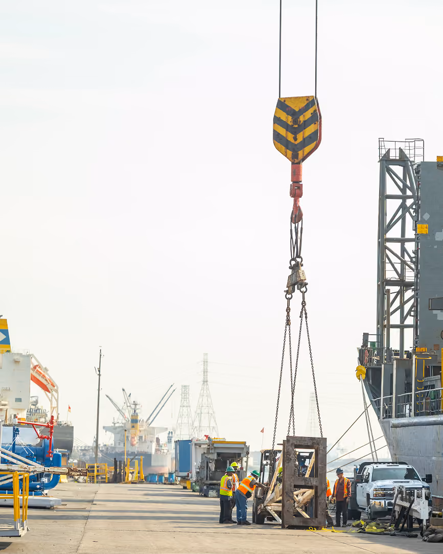 Crane lifting equipment on a busy dock