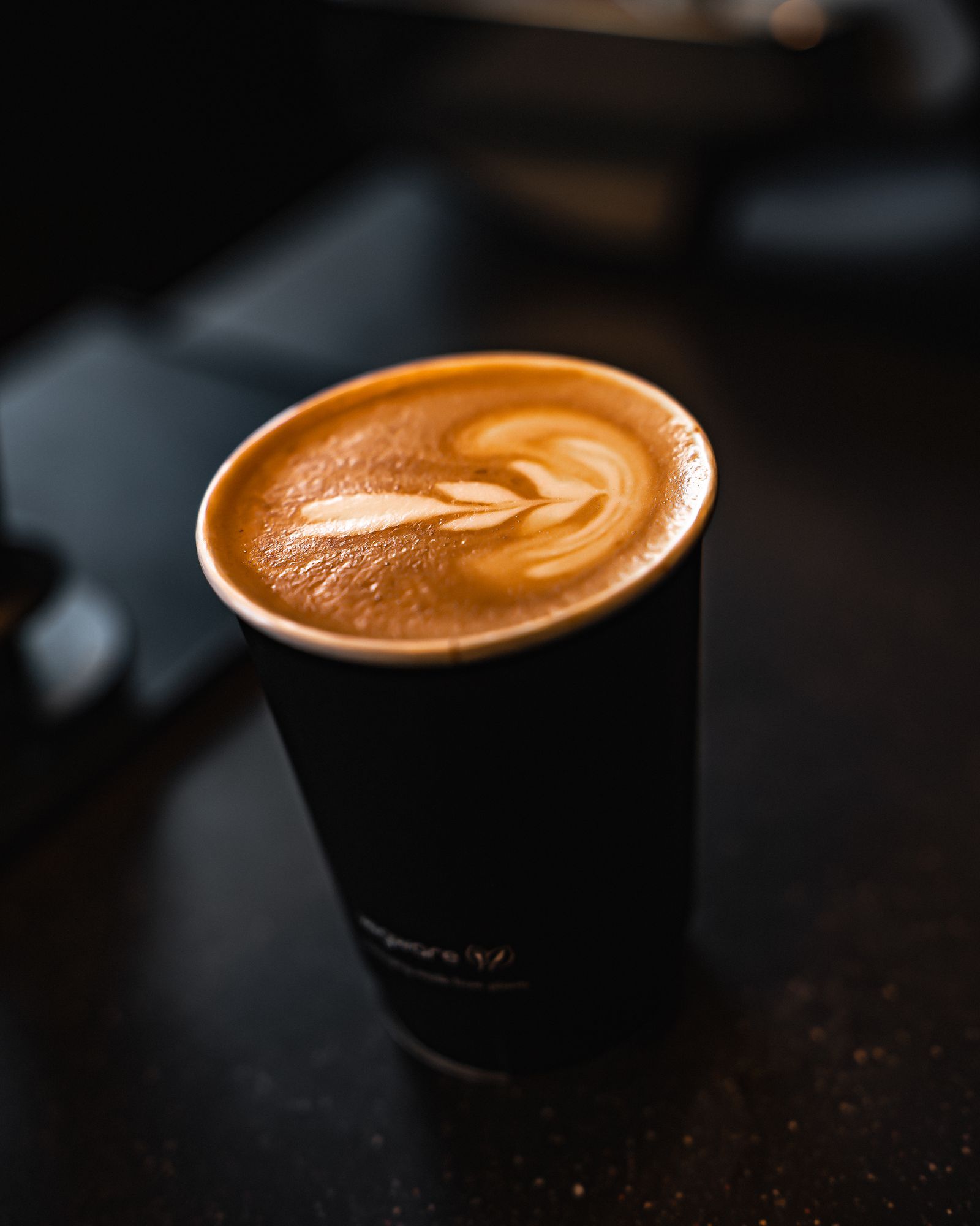 Latte with latte art made with Dark Arts specialty coffee on a Slayer espresso machine at Ritual Cafe in Angel, Islington