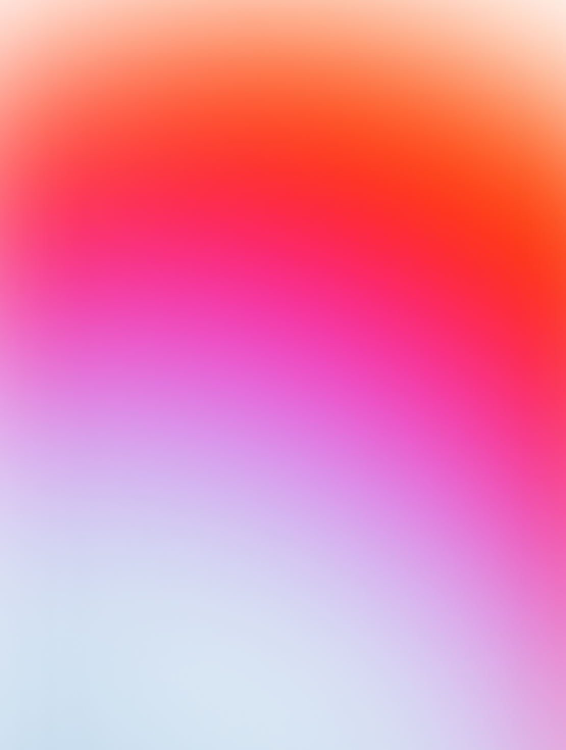 Blurred gradient background with colors blending from white at the bottom through pink and purple to orange and red at the top.