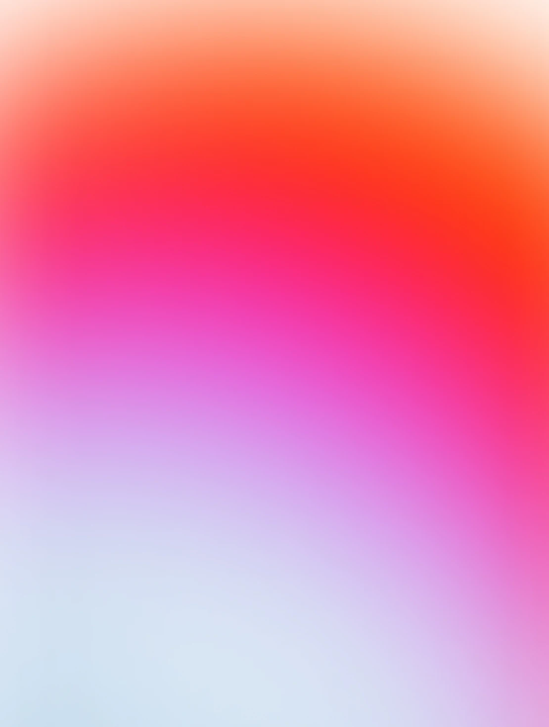 Blurred gradient background with colors blending from white at the bottom through pink and purple to orange and red at the top.