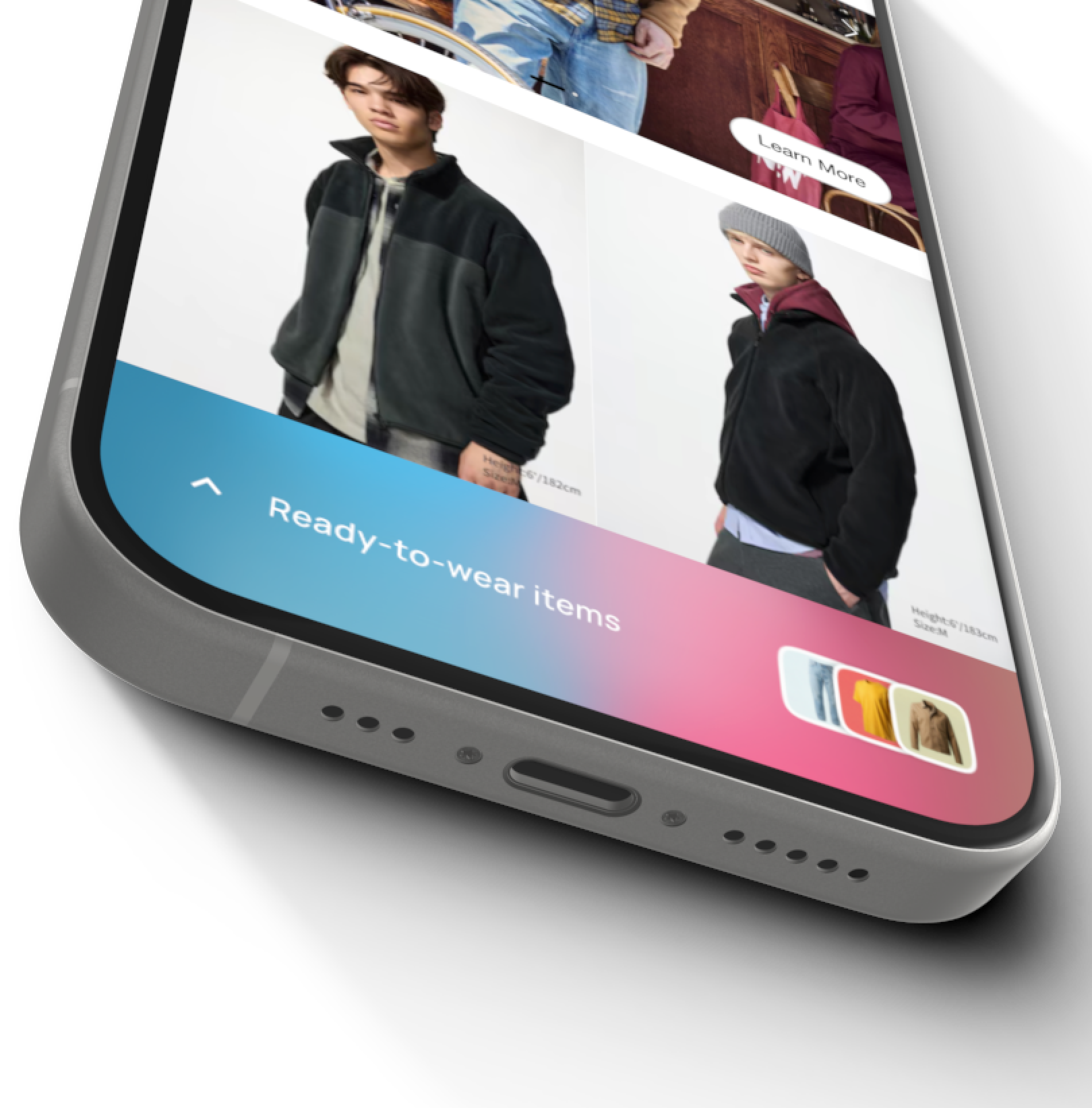 Close-up of a smartphone screen displaying an online store with two male models wearing casual jackets; one jacket is black with a grey section, the other black with a maroon hood and grey beanie. Below the photos is a gradient blue to pink banner labeled 'Ready-to-wear items' with thumbnail images of various clothing items.