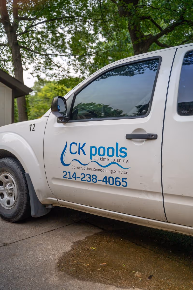CK Pools service truck parked outside a residential property