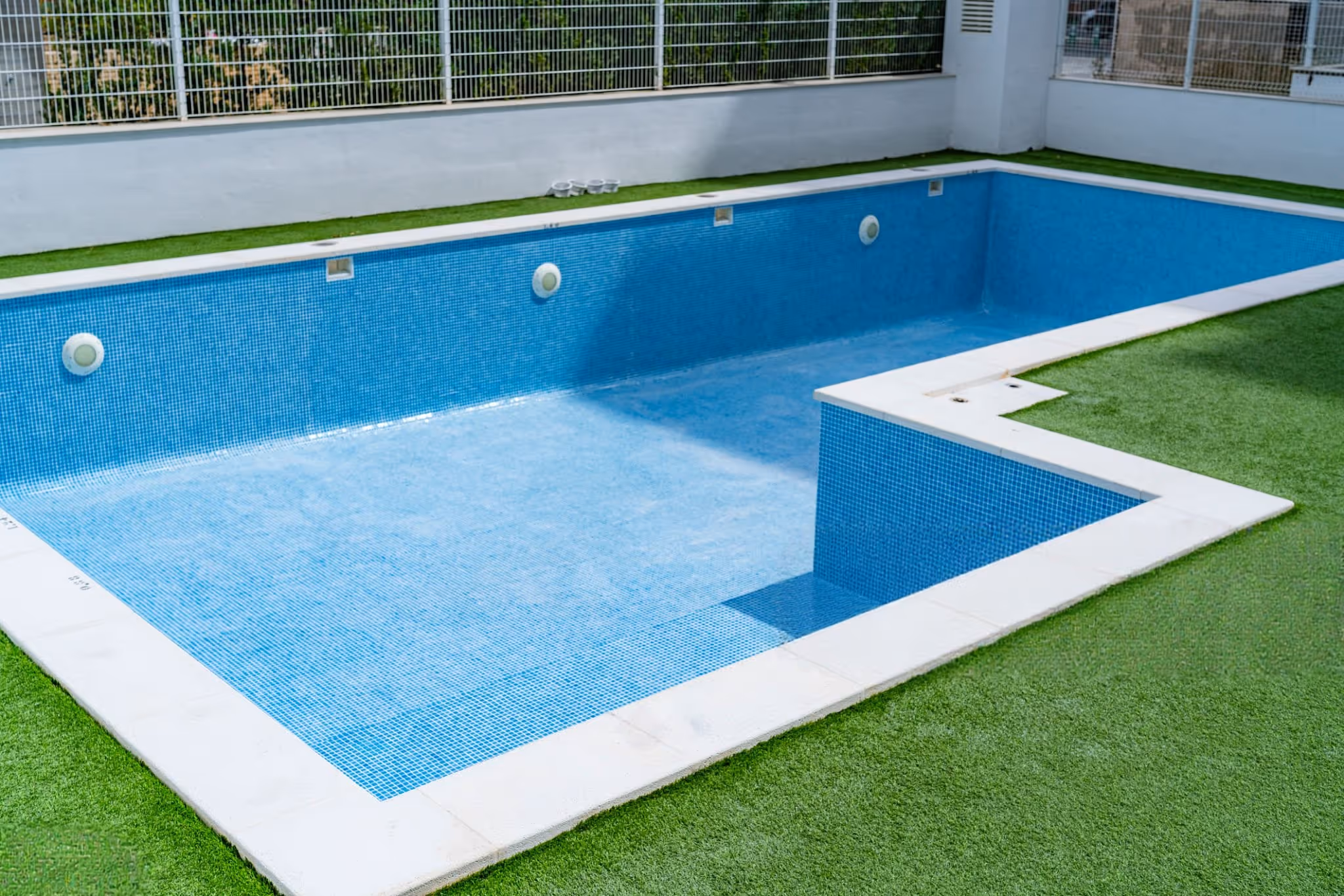 Pool remodeling service updating tile and finishes on a residential pool