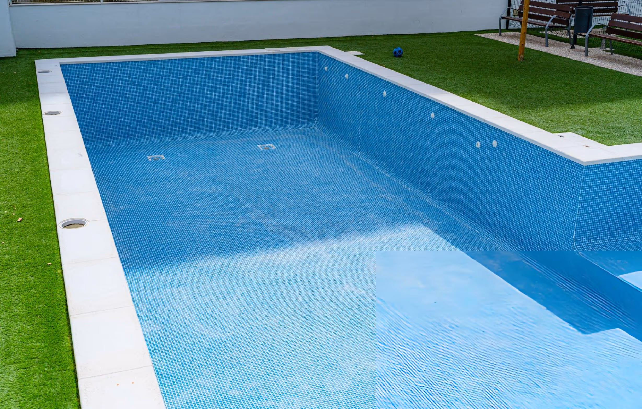 Residential pool remodeling service transforming an outdated backyard pool