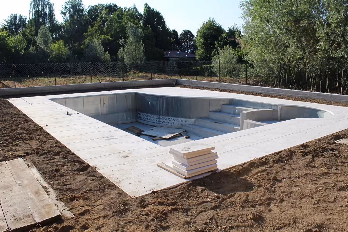 Custom pool construction transforming a backyard with a new swimming pool