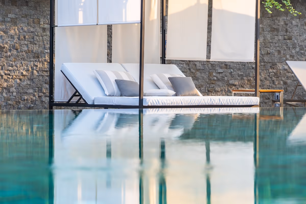 Residential pool cleaning service in Texas – technician cleaning swimming pool