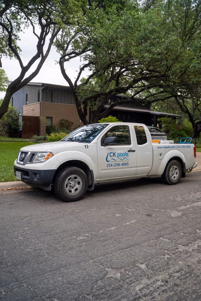 CK Pools service truck parked in a residential neighborhood
