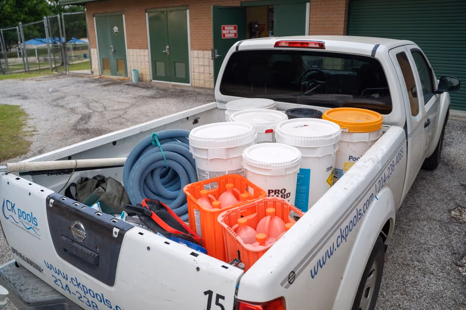 CK Pools service truck loaded with pool chemicals and maintenance equipment