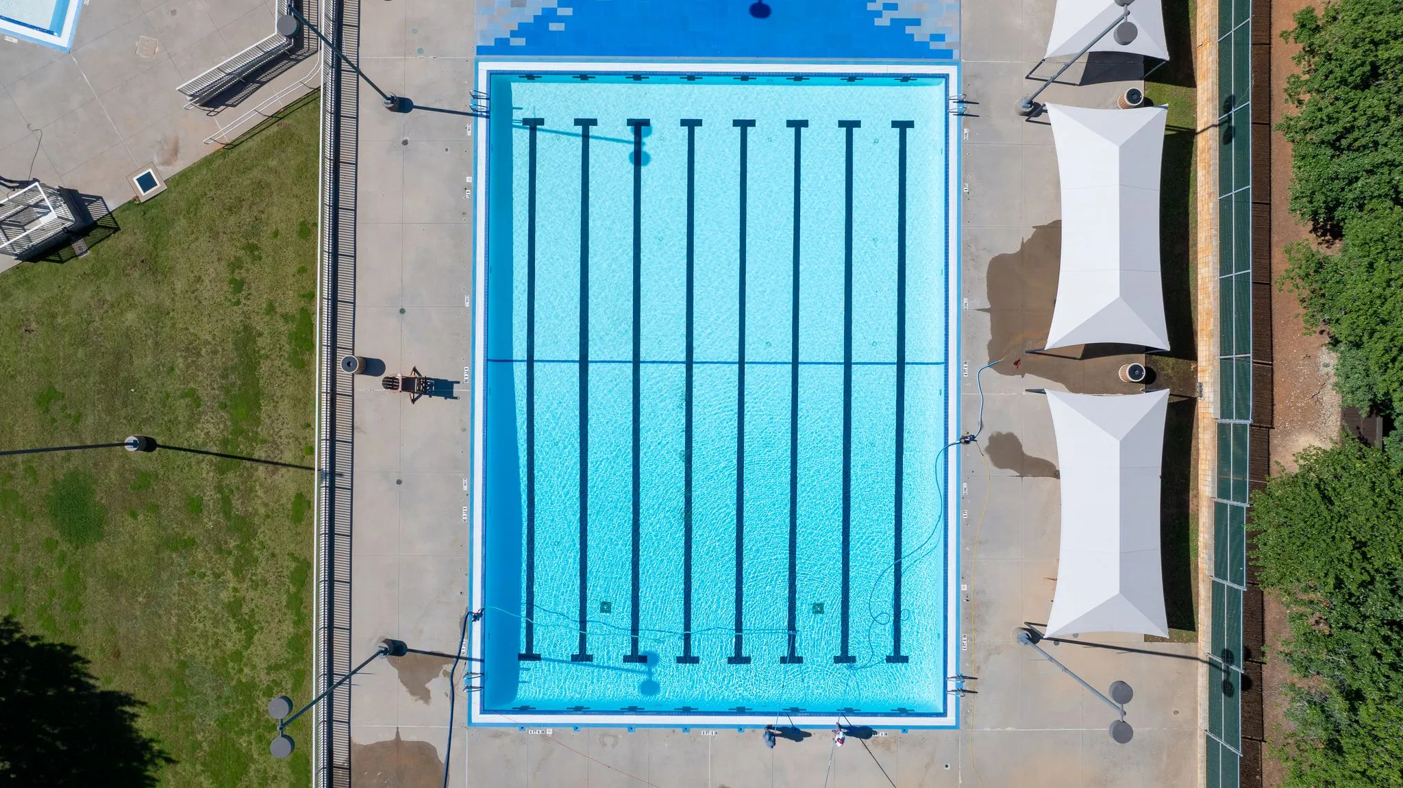 Aerial view of a professionally maintained outdoor lap pool