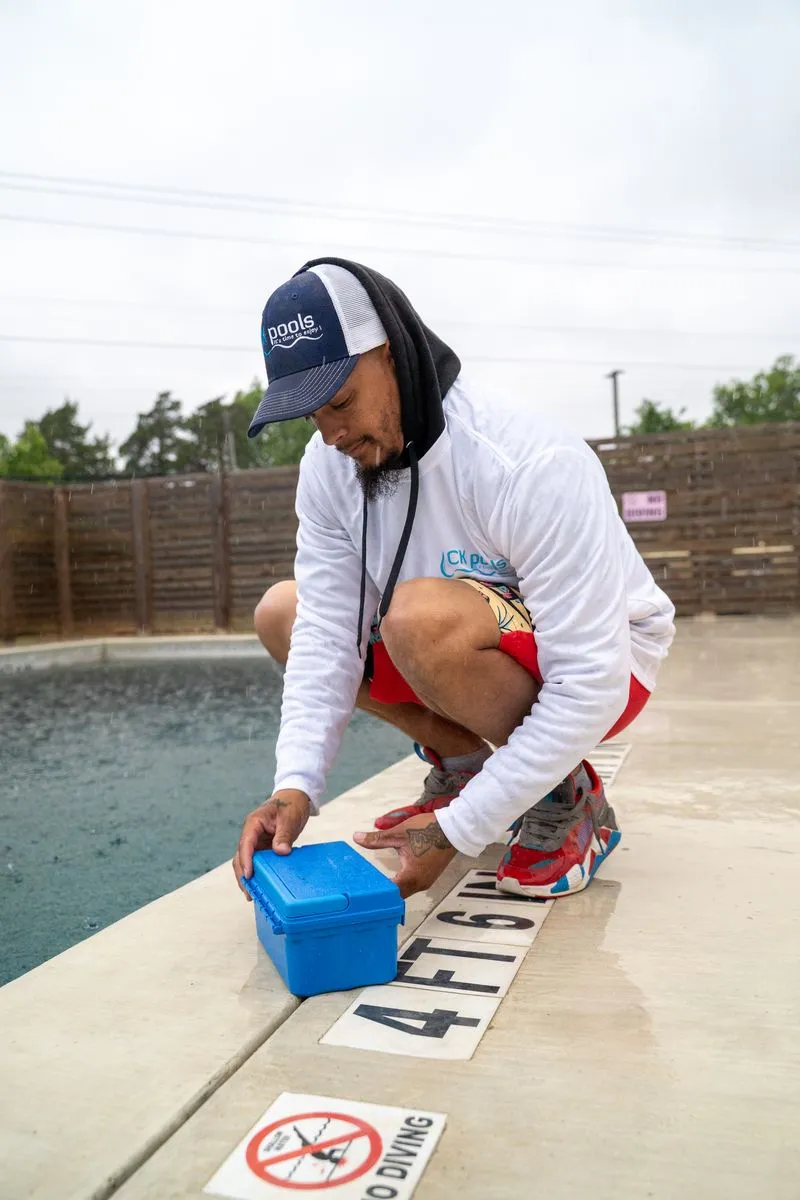 CK Pools technician testing commercial swimming pool water
