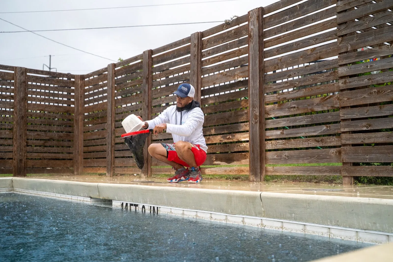 CK Pools technician testing commercial swimming pool water