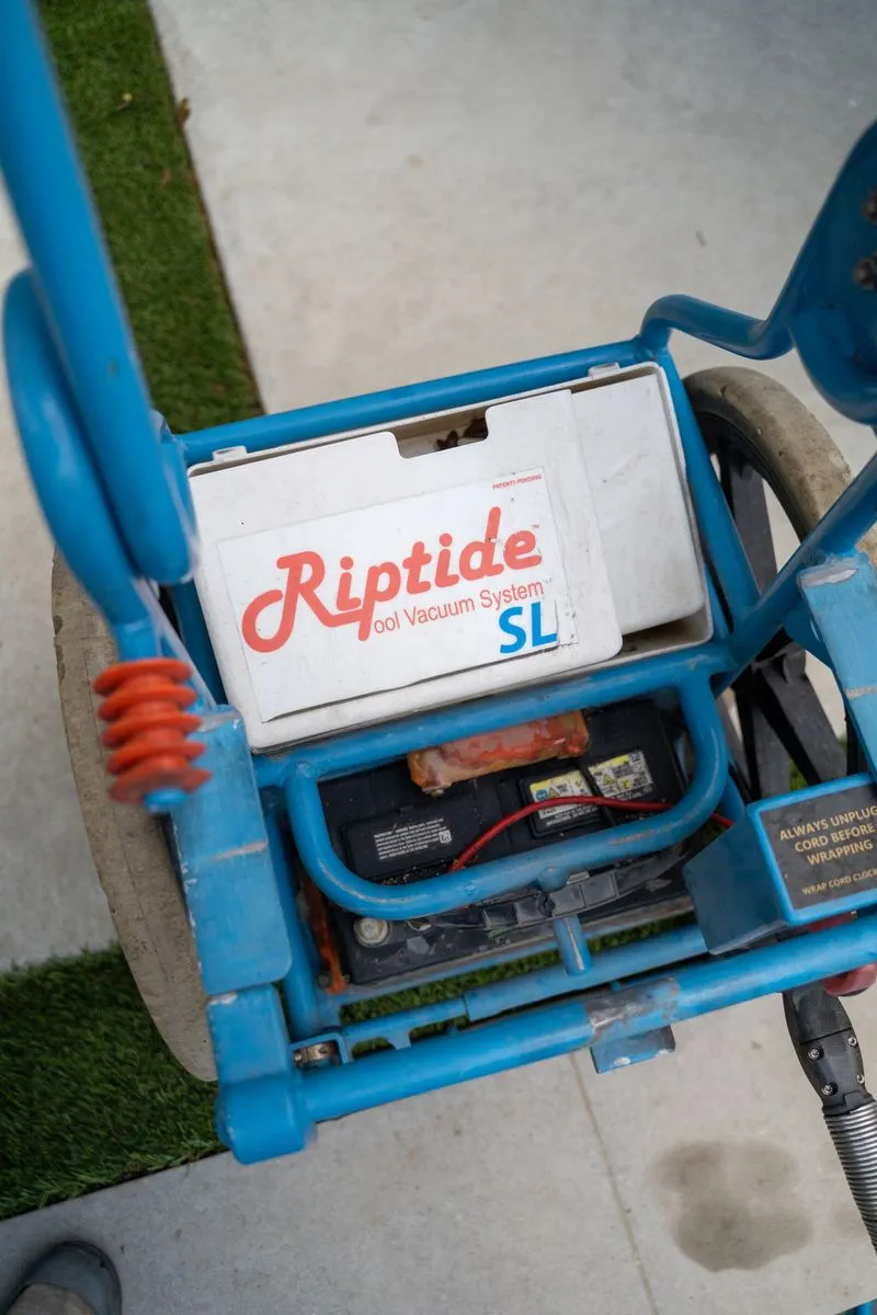 Close-up of professional pool vacuum equipment used by CK Pools