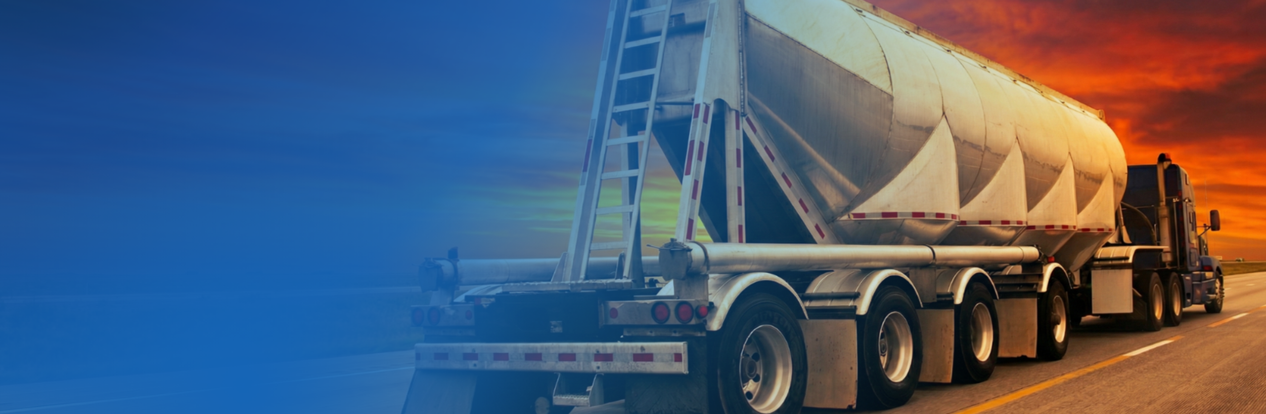 Pneumatic dry bulk trailer on the highway at sunset with a blue gradient overlay