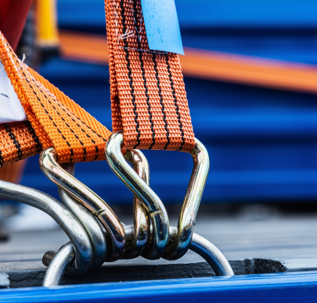Orange ratchet straps securing cargo