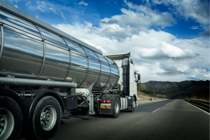 Stainless steel liquid tanker truck on a highway