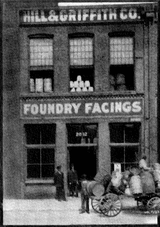 Historic black-and-white photo of the Hill and Griffith Co. foundry facings building with horse-drawn wagons
