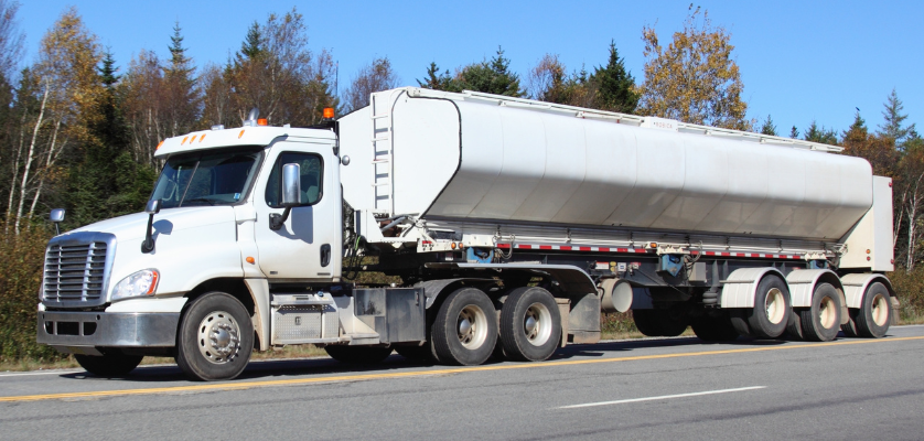 White tanker truck on the highway