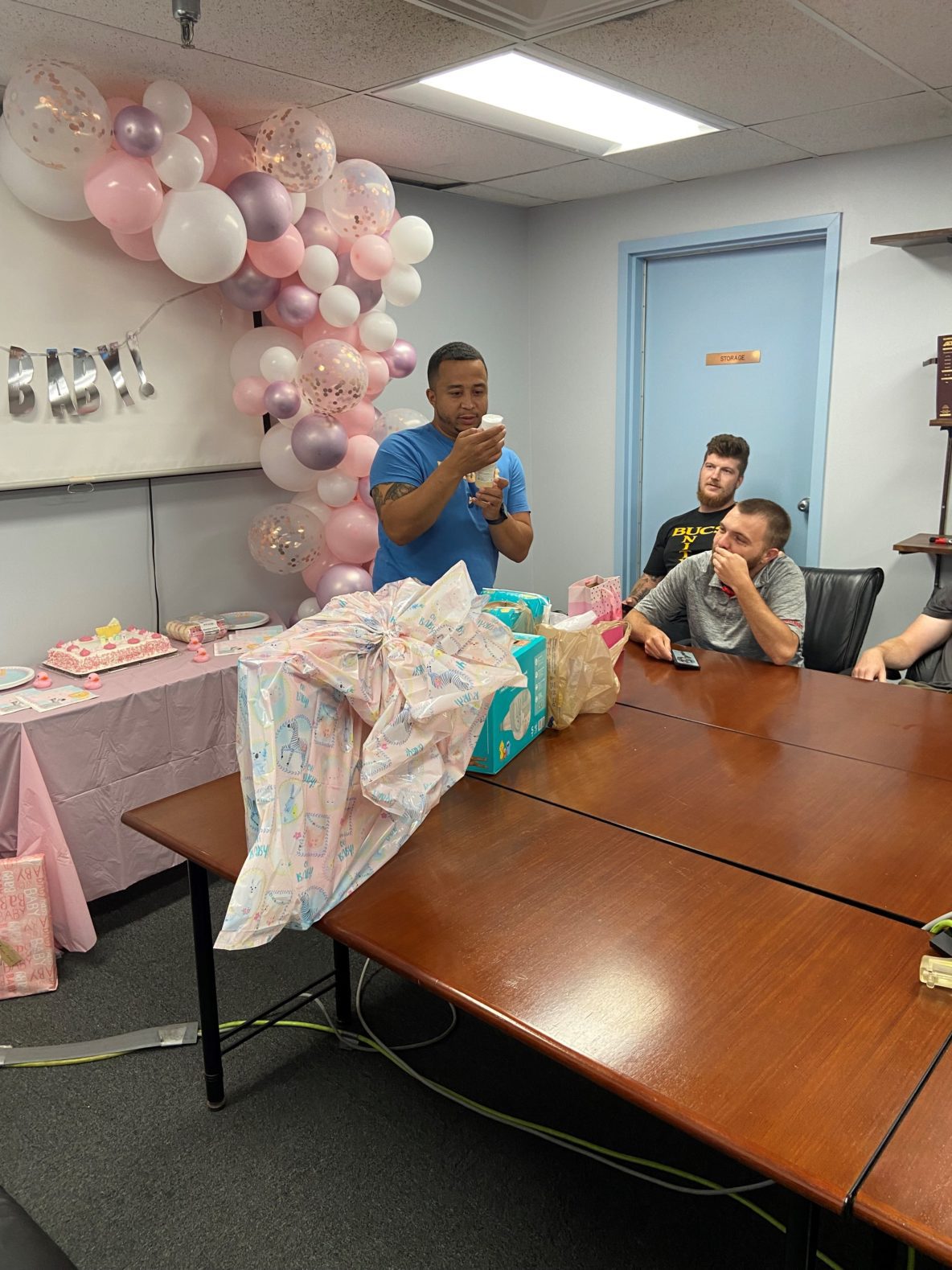 HG Logistics Showers Employee, Chris, with Baby Essentials