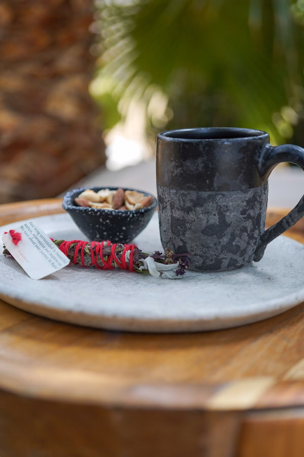 Ceramic mug, snacks and flowers on a serving tray