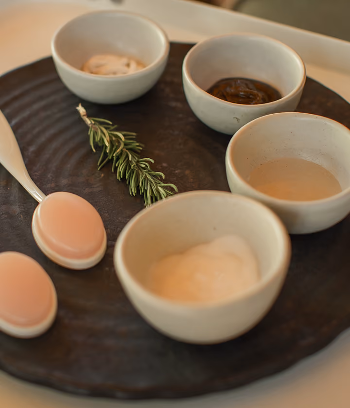Spa treatment bowls with salts, oils and rosemary