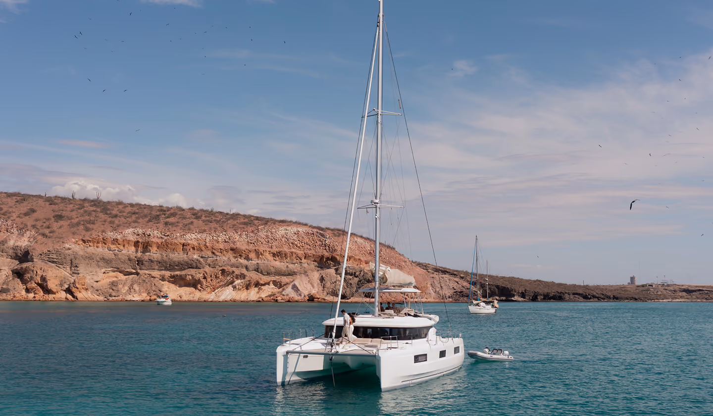 Sailing catamaran anchored in a turquoise Baja bay
