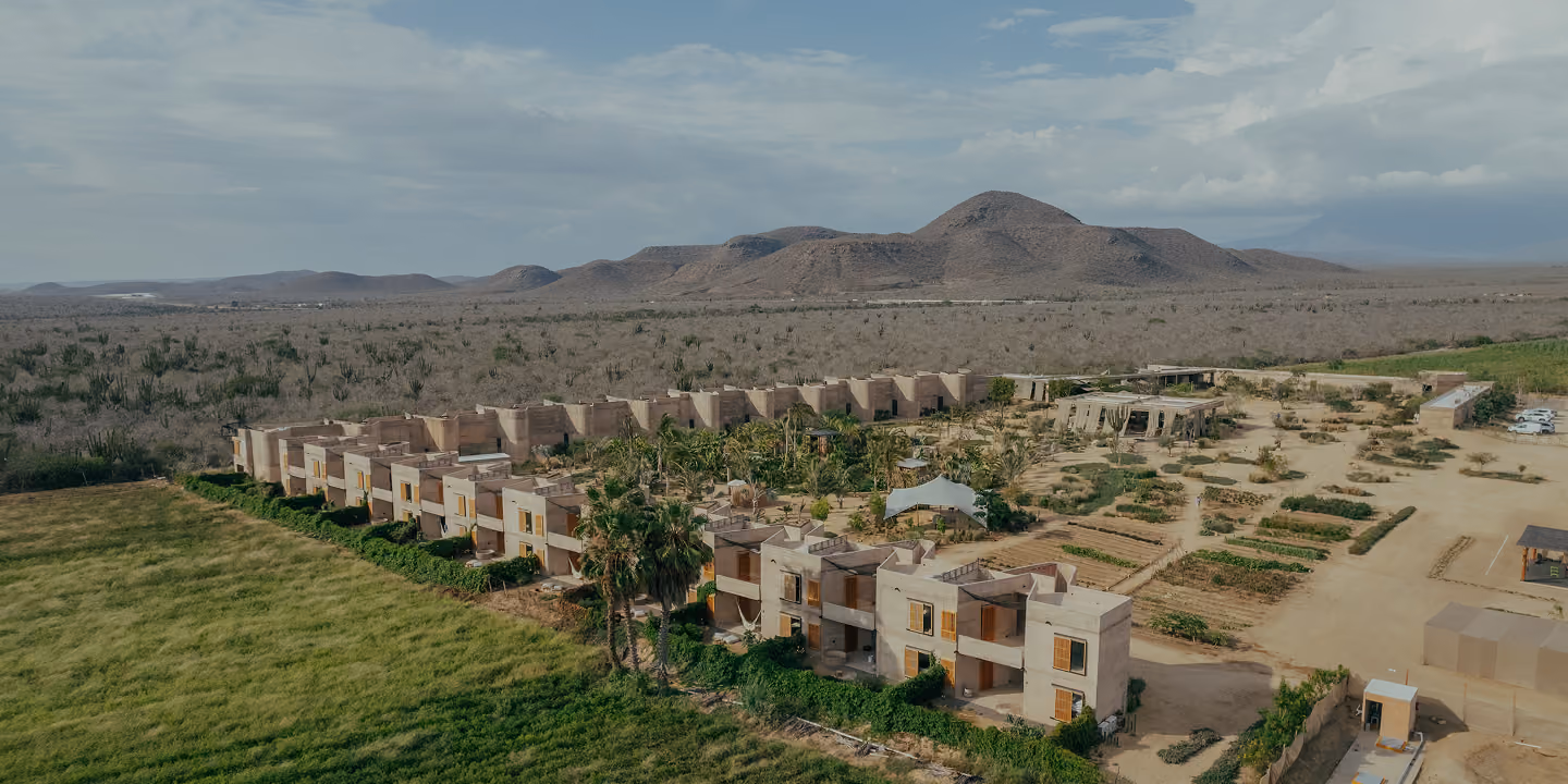 Aerial view of Paradero suites among farm fields and mountains