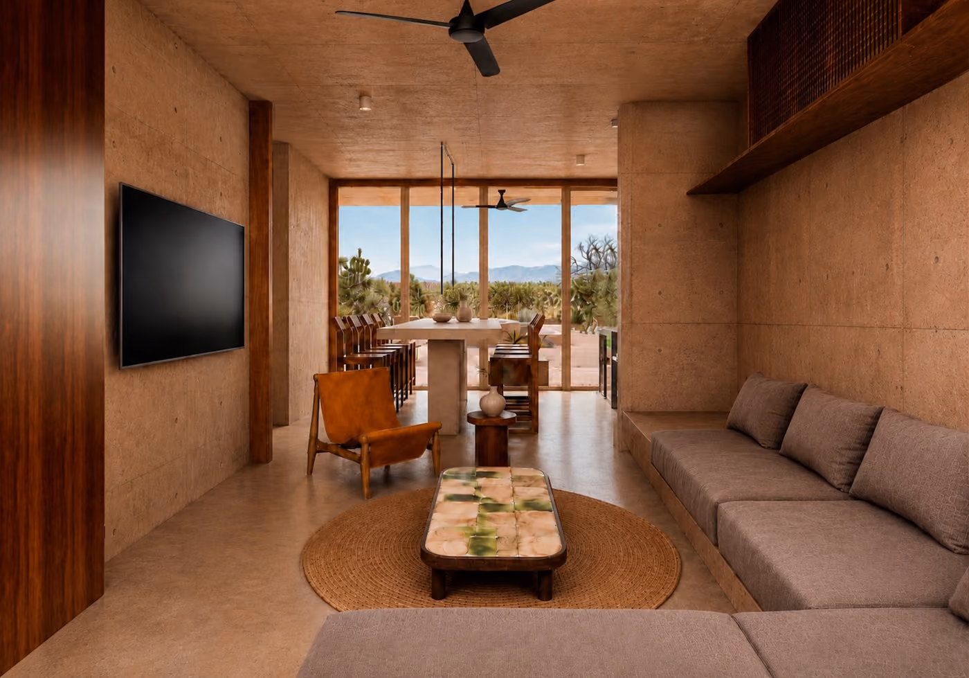 Residence living room with sofa, dining table and desert views