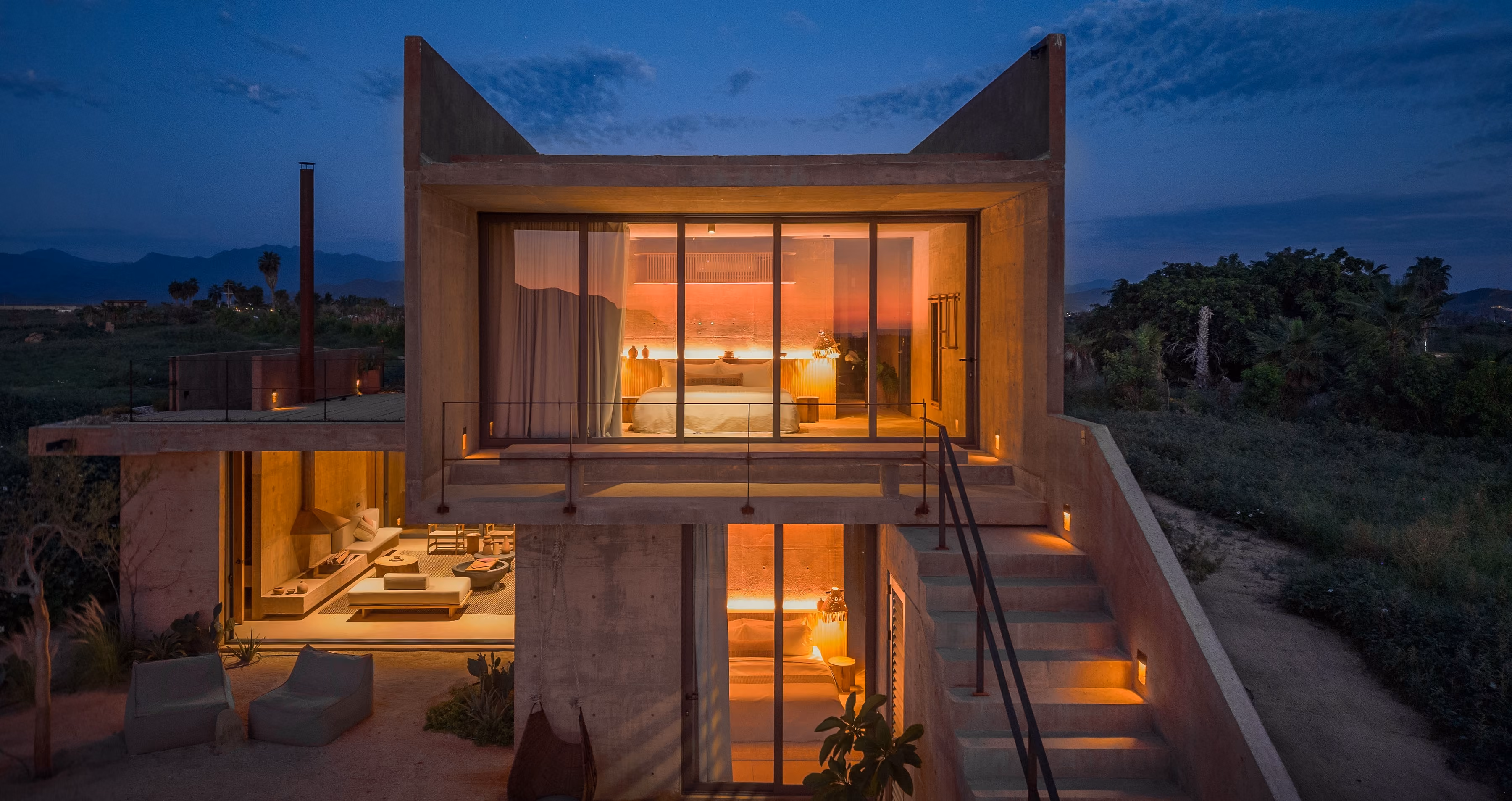 Concrete residence terrace with plunge pool and desert garden