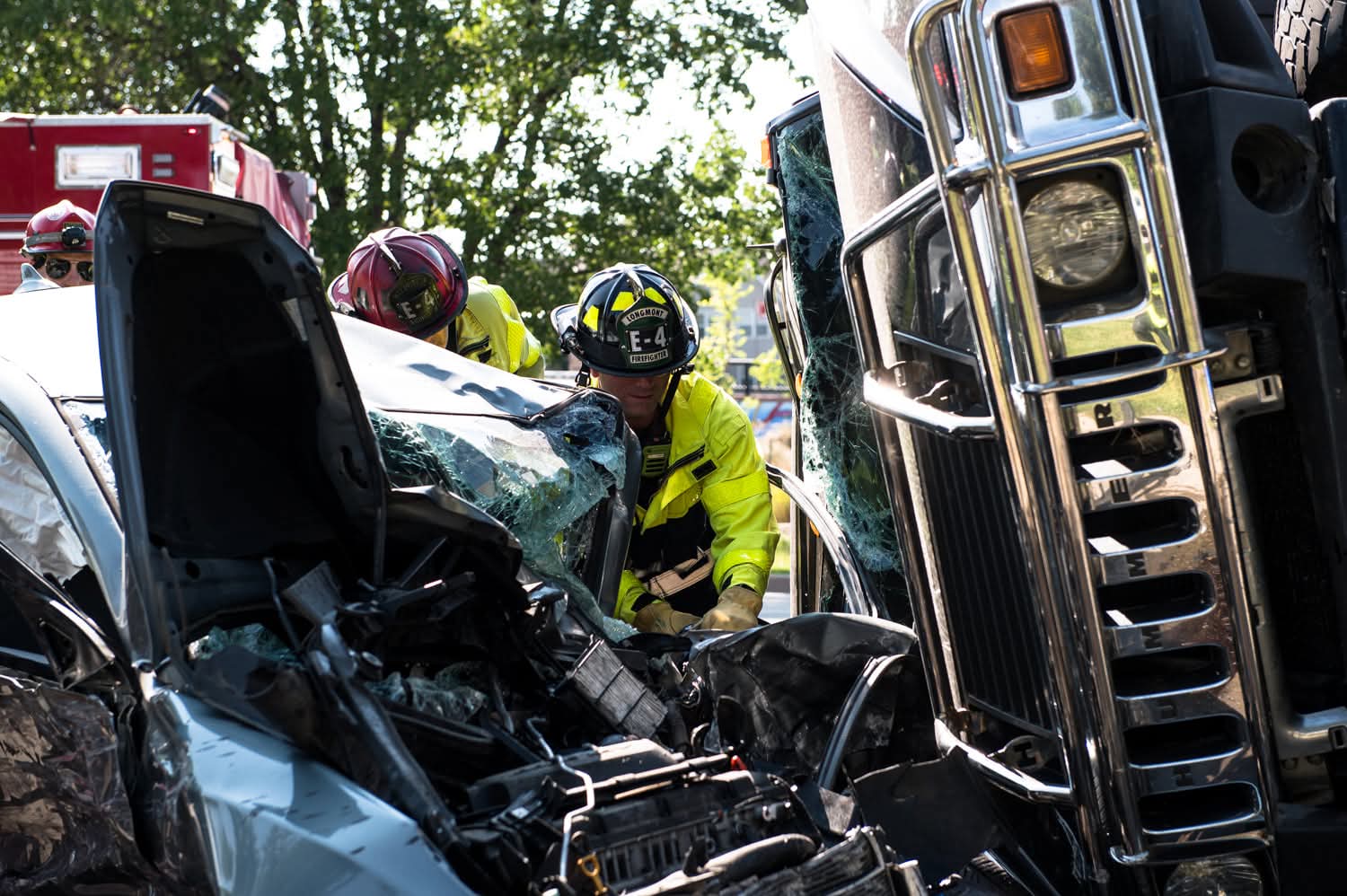 Firefighter using a hydraulic rescue tool on a car