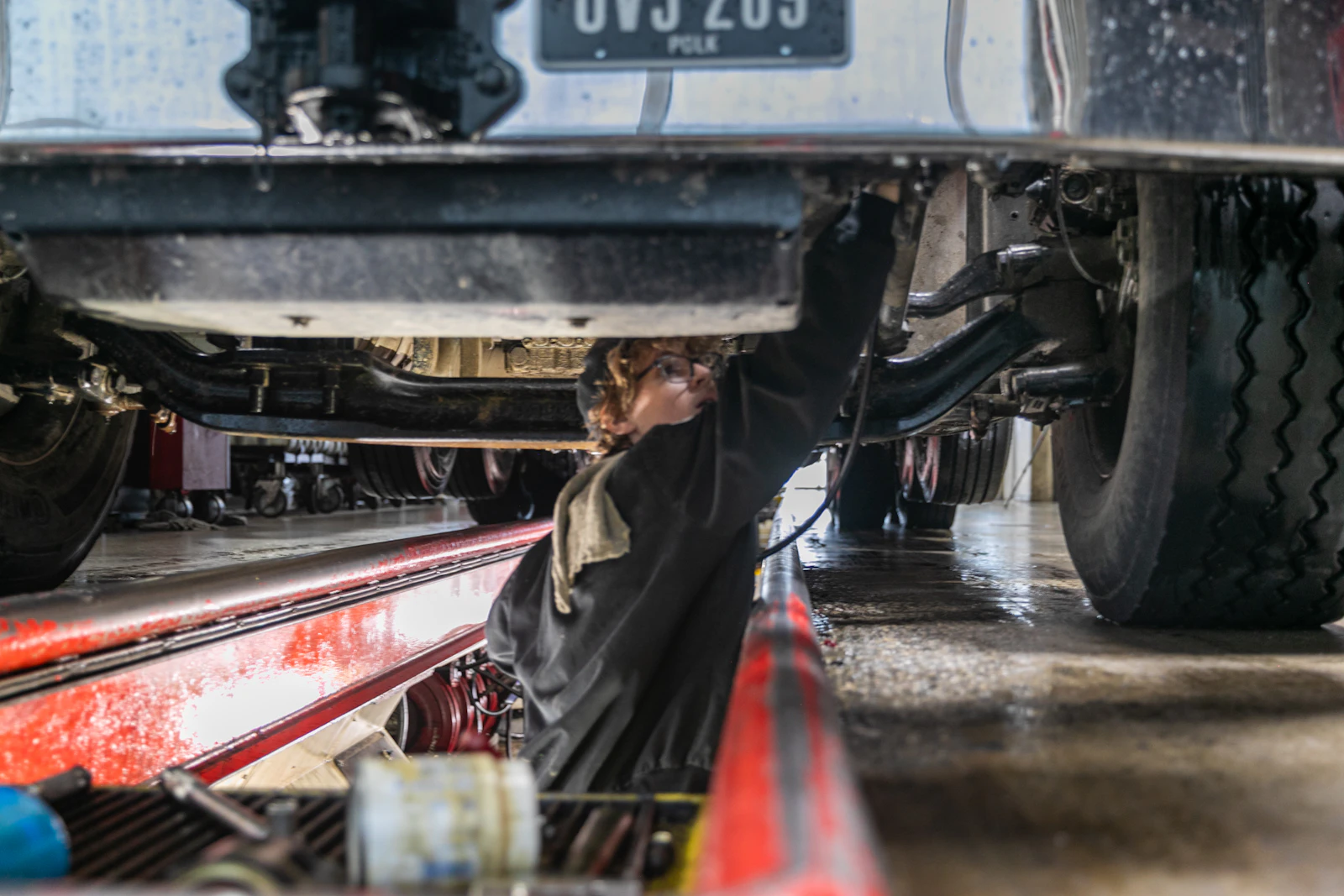 Diesel mechanic performing truck repair