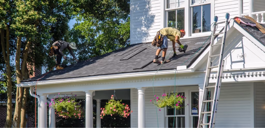 WellPro team working on a commercial building roof