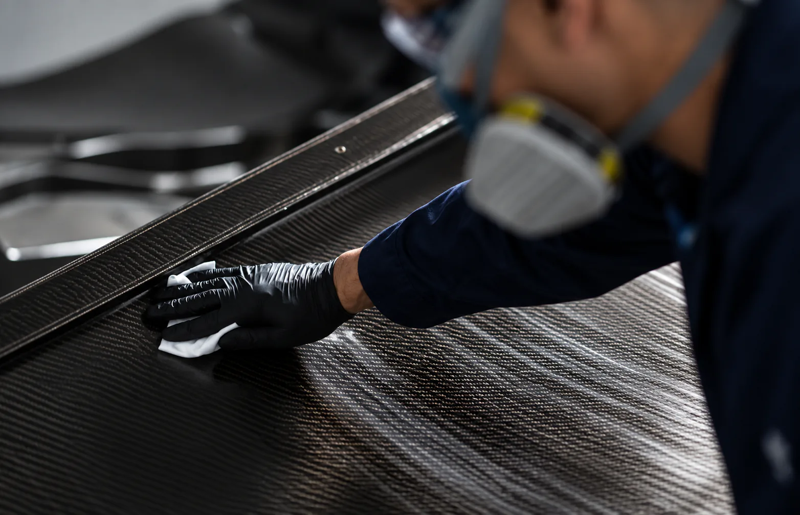 Technician working with carbon fibre