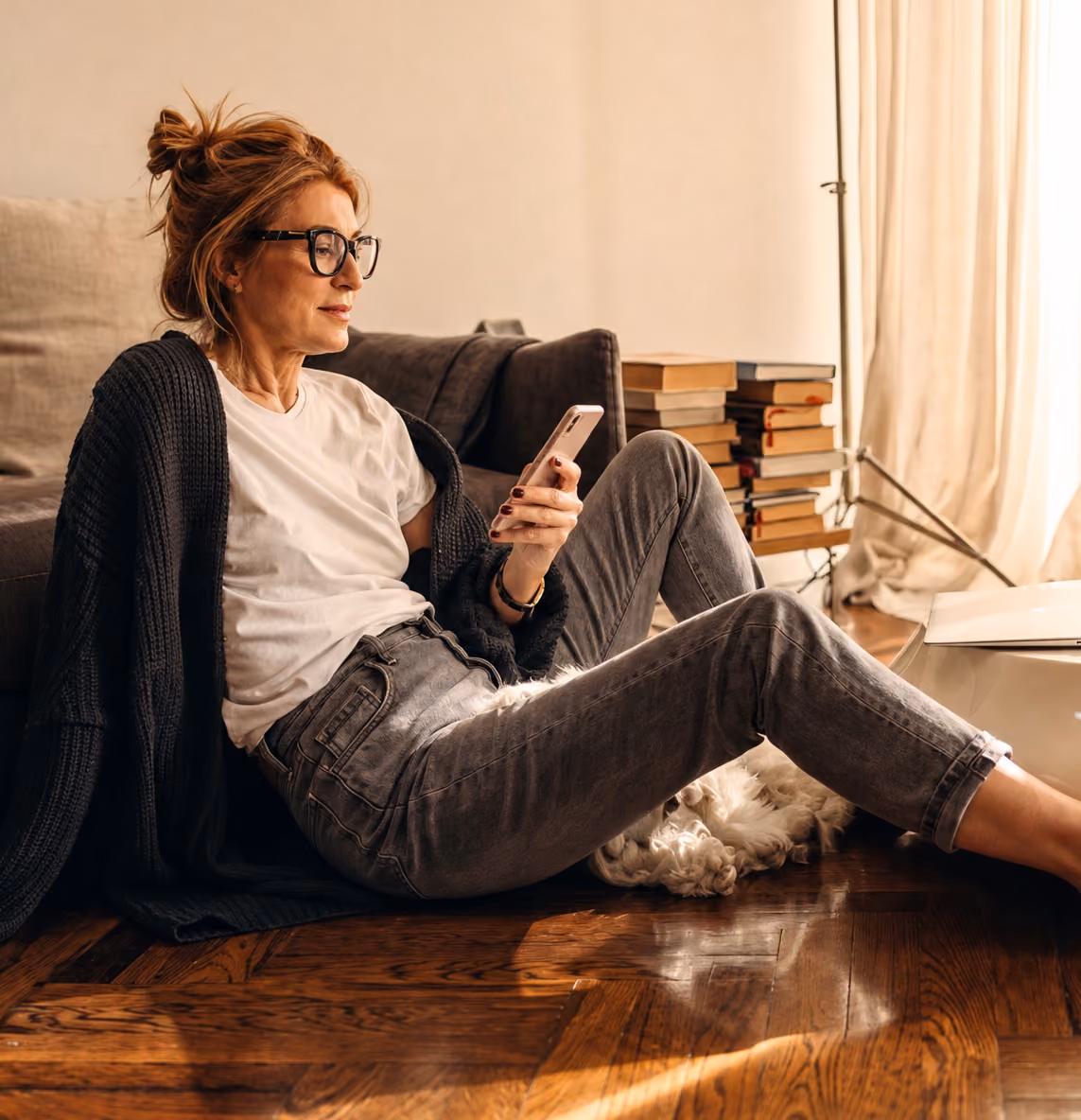 Woman looking at her phone with chat notifications showing a billing dispute being escalated and transferred to tier-2 support.