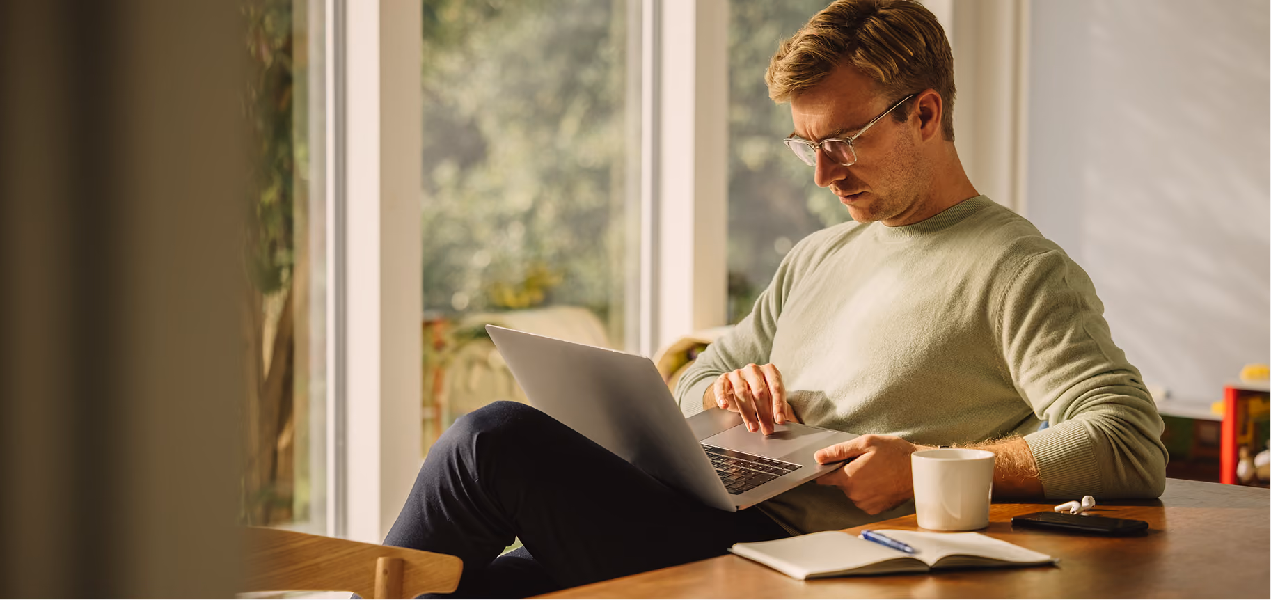 Man reviewing an insurance billing question on his laptop.