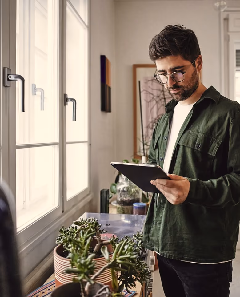 Man using a tablet with insurance platform integration icons