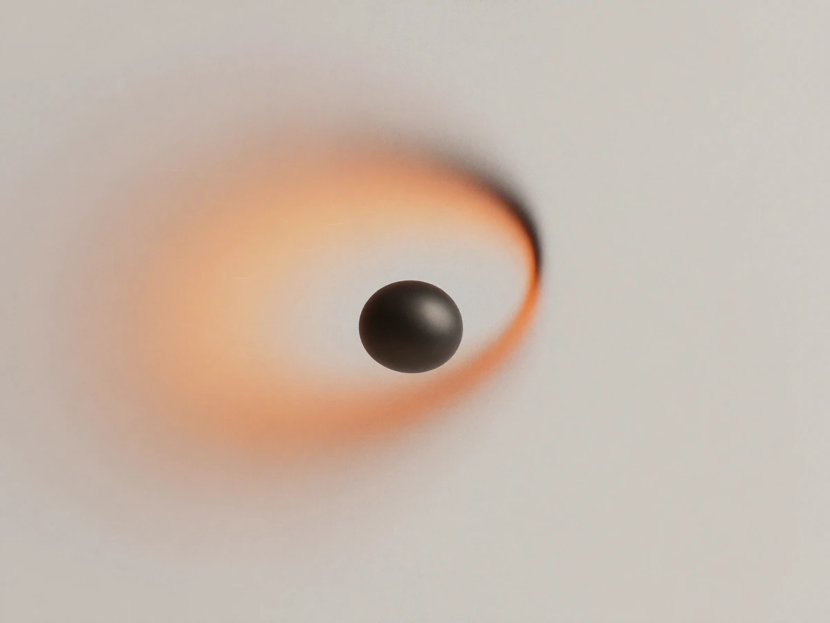 Dark sphere in motion with an orange light trail