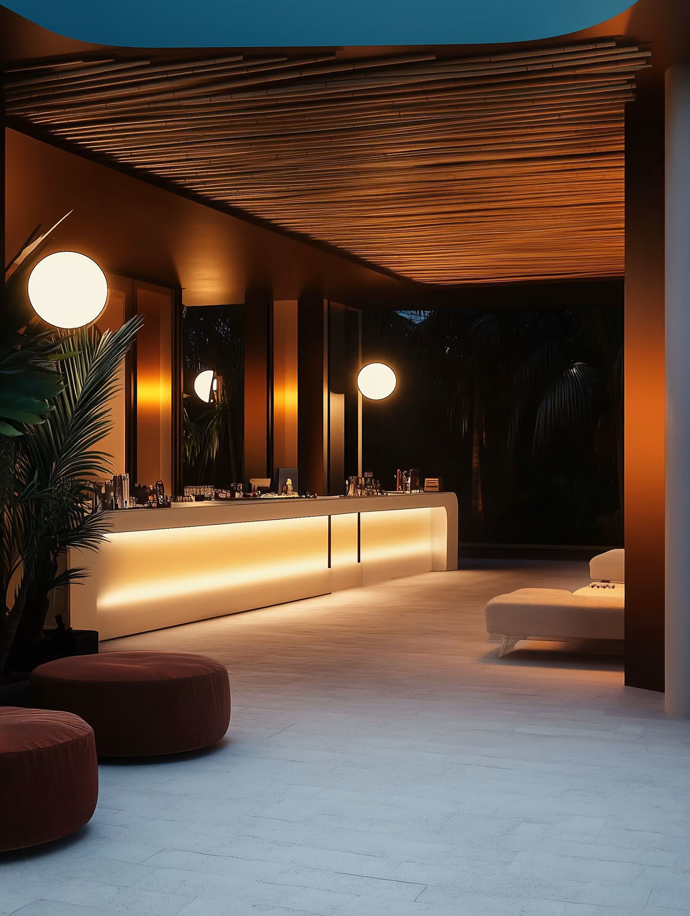 Warm, dimly lit bar interior with a long counter and low lamps