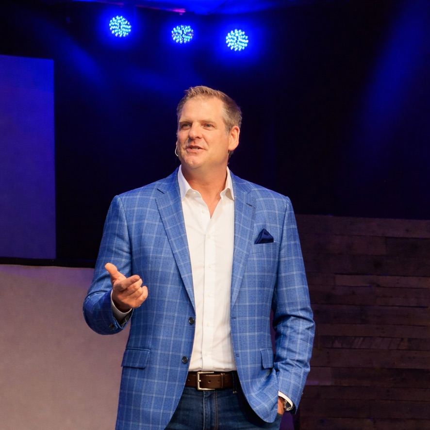Dr. Jeff Spooneybarger speaking on stage