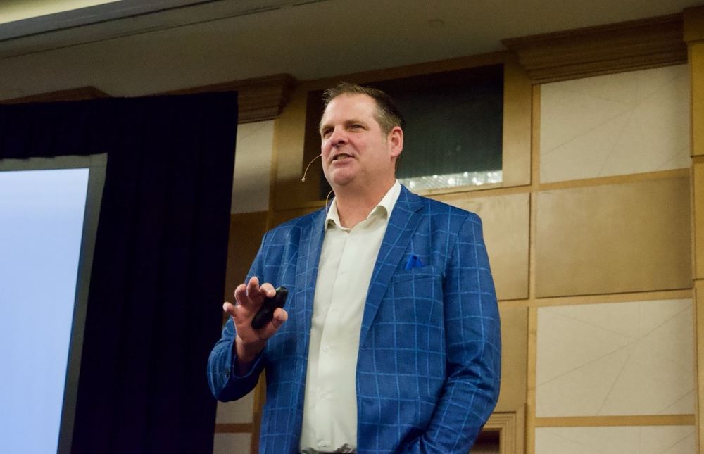 Jeff delivering a keynote at a conference