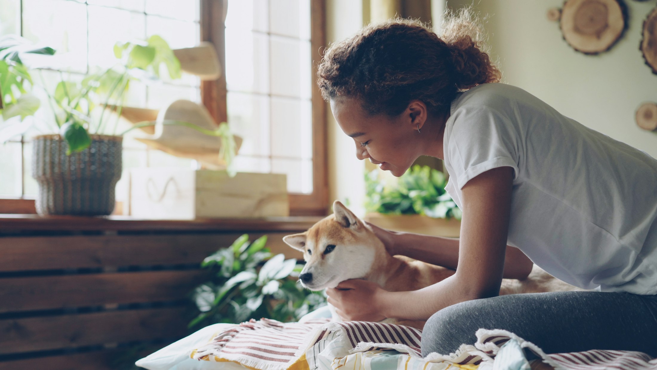 A woman at home with her dog