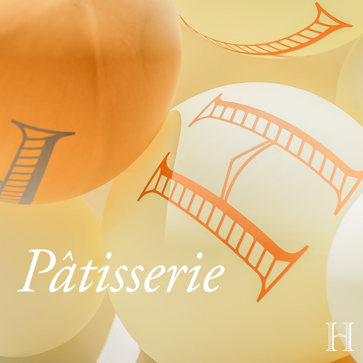 Champagne Henriot, note de dégustation : « Pâtisserie », des ballons orangés marqués du H de la maison