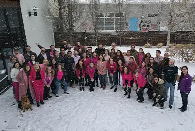US team photo outside the Denver office