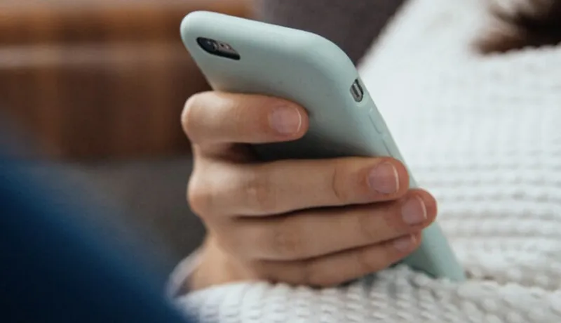 Woman looking at her phone.