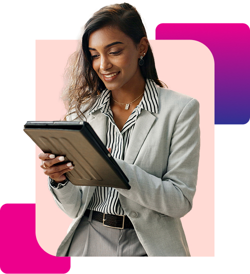 Smiling woman in a gray suit using a tablet with abstract pink and purple shapes in the background.